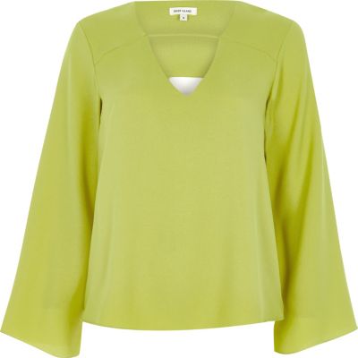 Lime green twist back bell sleeve blouse